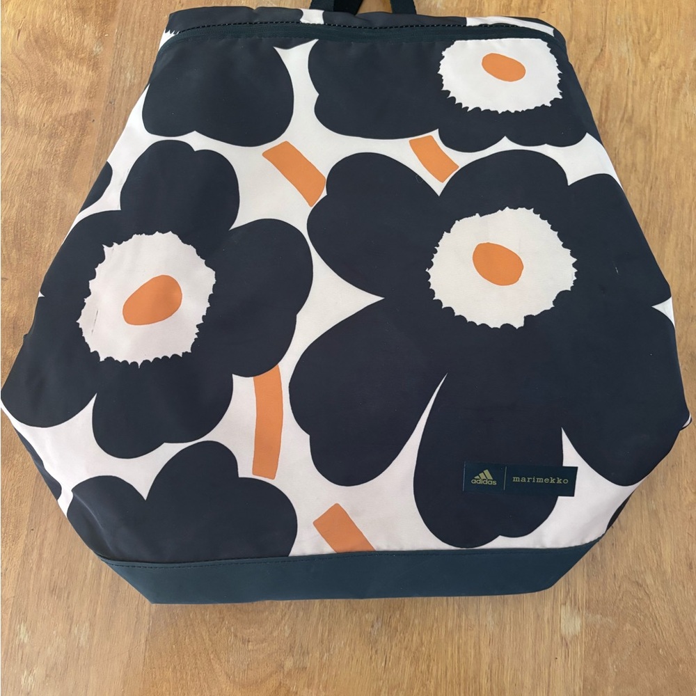 Marimekko Black and Orange Backpack with Iconic Floral Design